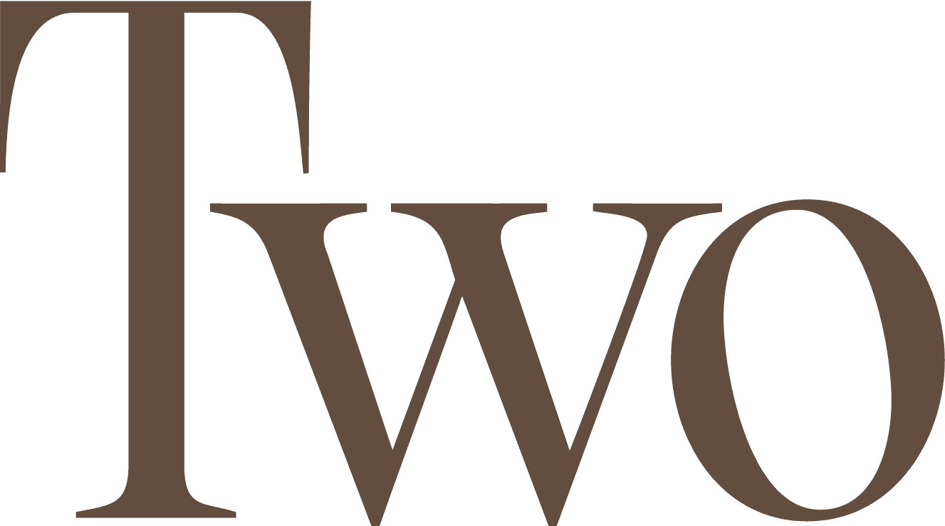 The word "Two" is displayed in large, bold, serif font with brown coloring on a transparent background.
